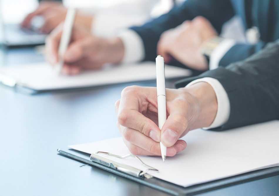 Business people writing notes